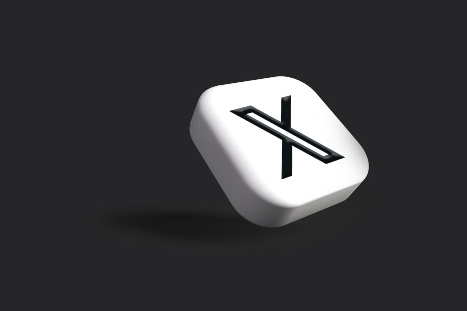 a white dice with a black x on it